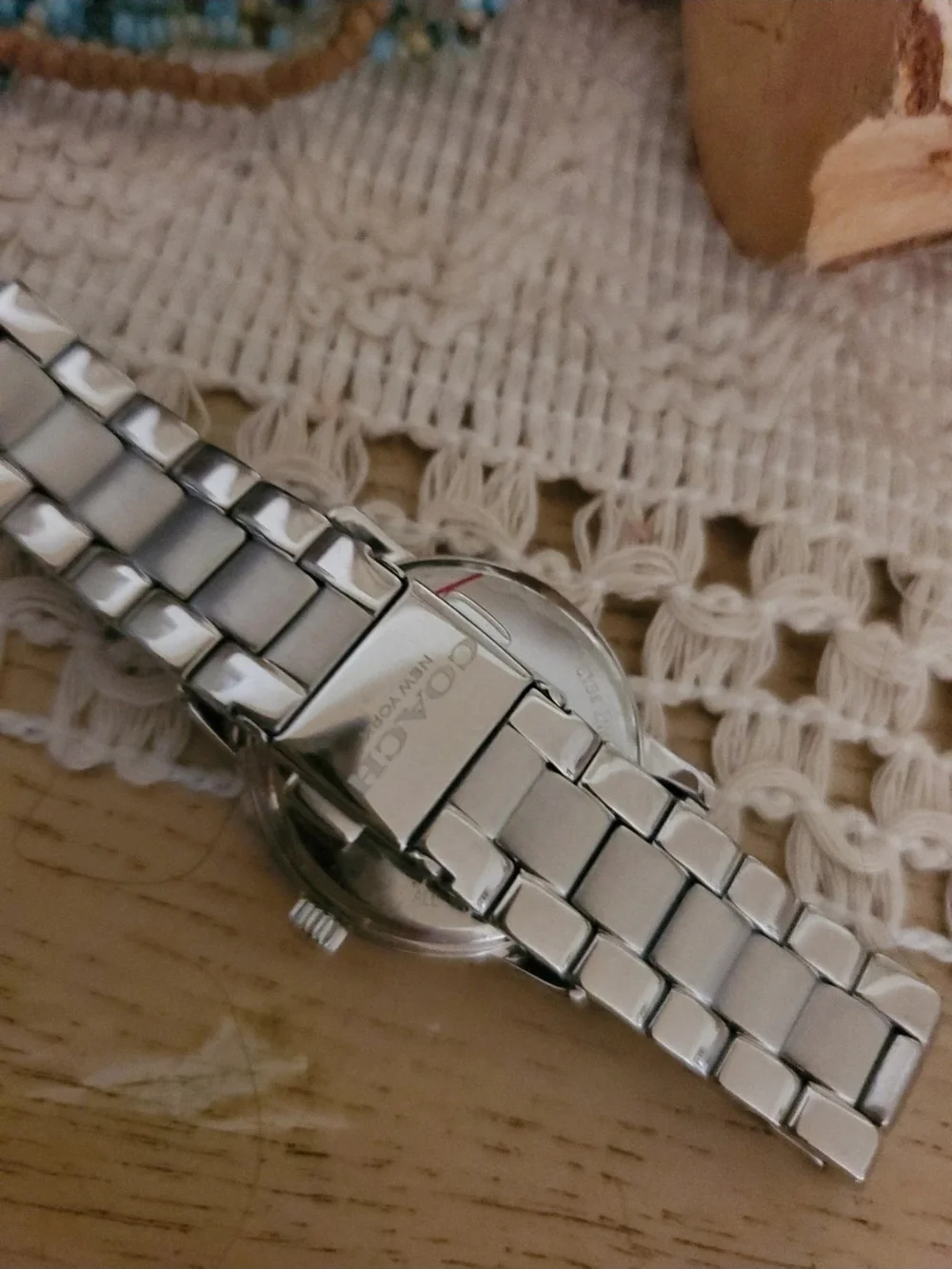 Coach Silver Tone Women's Watch with White Dial and Horse & Carriage Motif